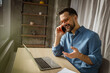 © Miljan Živković - Man having phone call working from home office