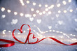 © Jakieaart - Heart ribbon on glittering background with bokeh lights. Elegant romantic love scene.