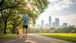 © Arina - Young man jogging with his golden retriever dog on a path in an urban park with a city skyline for a healthy lifestyle concept and morning routine