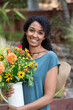 © Rachel Weill - Black woman holding fresh cut garden flowers