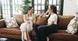© Azeemud25/peopleimages.com - Women, conversation and relax in living room for reunion, share gossip and chat for bonding session. Speaking, listening and friends together for weekend visit in home, people and smile for support
