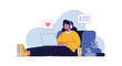 © Lily - Young woman wearing headphones while working on a laptop on a comfortable blue sofa with heart and comment social media icons.