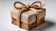 © MKS - A brown kraft gift box tied with twine, displayed on a light background for holiday, birthday, or special occasion gifting