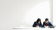 © BackgroundStudio - Two Japanese female high school students studying together at a