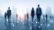 © sornram - A blurred silhouette of people connected by a network, symbolizing teamwork and collaboration in a digital age.
