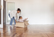 © mariamontoyart - Mother and daughter playing with box in new home