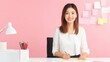 © mashimara - Woman at Workplace: A smiling woman at her workplace surrounded by notes and stationery supplies, exuding positivity and dedication.