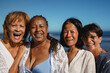 © Sabrina - Happy multiracial senor women smiling in front of camera during summer beach vacation - Joyful elderly female friends, holiday and tourism concept