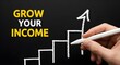 © Asad - Hand drawing upward trend chart on blackboard emphasizing concept of growing your income for better future