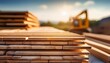 © Sophie - a stack of wooden planks on a construction site with a blurred background