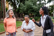 © Nexa - Group of diverse senior women laughing and enjoying time together in a public park