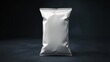 © Habiba Noor  Jannat - Shiny empty snack bag against dark background