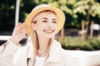 © halayalex - Young beautiful smiling blond woman in trendy summer clothes. Carefree female posing on the street background at sunny day. Positive model outdoors at sunset. Cheerful and happy in hat. Natural makeup