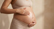 © solom - pregnant woman applying natural oil or moisturizer to her belly to prevent stretch marks and care for skin during pregnancy wellness and maternity body care at home