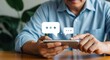 © AR Creations - Man using a smartphone to send messages, with chat bubble icons floating above the screen, indicating digital communication.