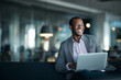 © PicStudio - Unique diverse dynamic interesting Happy relaxed confident young businessman in an open office with a laptop
