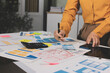 © Natchanida - team of UI UX web designer are working together to develop mobile responsive websites with UI UX front end designer previews, UI UX web development ideas, front end designer. application development