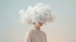 © Anna - Head in the Clouds. Surreal conceptual portrait. Woman instead of a head is a large fluffy white cloud and smoke. Part of the girl's face is visible. Pastel monochrome background