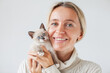 © Tatyana Gladskih - Attractive Woman with small cat kitten at white