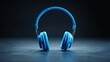 © mlion - Bright blue personal listening device rests centered on a dark textured surface with dramatic lighting