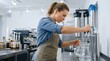 © Tatyana - Woman filling water pitchers at coffee shop counter with focus