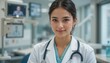 © Elegance Frames - Smiling young asian female doctor in hospital setting with stethoscope