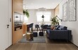 © Victor zastol'skiy - Modern living room interior with blue sofa and dining area. Open plan apartment design