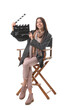 © New Africa - Professional film director with clapperboard on chair against white background