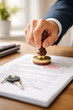 © thodonal - Hand stamping important documents with a seal and signature