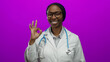 © Krakenimages.com - Doctor smiling woman black female professional medical stethoscope labcoat glasses pink background healthcare adult isolated happy adult
