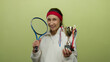 © Krakenimages.com - Young woman holding tennis racket and trophy smiling confidently against isolated yellow background showcasing athletic achievement and joy.