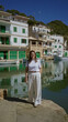 © Krakenimages.com - Woman enjoying a sunny day at cala figuera port in mallorca surrounded by boats and traditional mediterranean architecture.