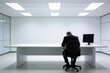 © AspctStyle - Mature businessman sitting alone slumped over a minimalist white desk in a sterile modern office with copy space for stress or failure concept.