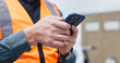 © peopleimages.com - Outdoor, civil engineer and hands with smartphone, online and texting with contact for construction. Typing, message and person with mobile on site, builder and communication for property development