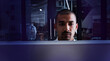 © JamPacked/peopleimages.com - Businessman, programmer or night with computer for software development or UI interaction. Man, developer or code working late in dark room for programming, tech innovation or debugging app in office