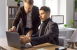 © Studio Romantic - Business colleagues managers analyst conduct teamwork planning meeting. Two professionals review notes on a laptop in a bright office, Strong concept of business teamwork and leadership.