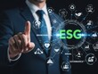 © farjana - Businessperson Pointing to E S G Environmental Social Governance Concept with Digital executive suit