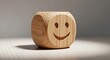 © MSTAnuara - Wooden smiley face cube on a table with a shadow  symbol of happiness and positivity