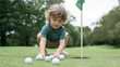 © Bonsales - Child concentrating while arranging golf balls on a putting green, developing early sport skills and enjoying the game