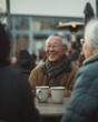 © aimired - senior friends enjoying coffee outdoors