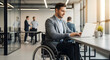 © Pixel By Bi - A man in a wheelchair working on a laptop in a modern, bright office environment.