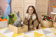 © New Africa - Little girl with cute Easter bunny in wooden crate indoors