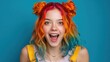 © mila103 - Vibrant young caucasian female with colorful rainbow hair and excited expression.