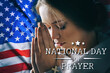 © Pixel-Shot - Beautiful young woman praying on dark background