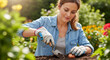© OlgaNeuroArt - Woman planting a flower bulb in the garden soil with a trowel. Happy female gardener enjoying her outdoor hobby in spring