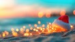 © tashechka - Santa hat on sand with lights at sunset by the beach during holiday season