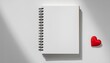 © photostockatinat - A spiral notebook and a heart, perfect for writing a love letter