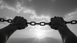 © NARUMOL - Struggling hands grasping chain against dramatic sky, symbolizing strength and resilience in face of adversity