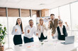 © deagreez - Diverse office team celebrating success at work in a modern workplace with enthusiasm and joy