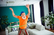 © deagreez - Funny grandpa hula hoop chaos brings playful energy to a cozy home living room
